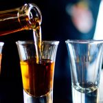 Alcoholic shots being poured