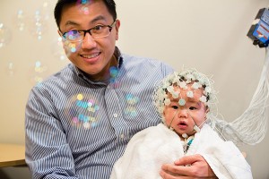 Brand - Creative 02 baby with medical device on head