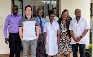 Tori Robinett (second from left) with KCMC leadership and staff.