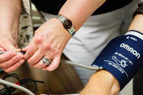 person getting their blood pressure taken