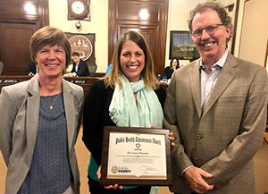 Amy Westbrook, Laura Palombi, and Frank Jewell standing together and smiling.