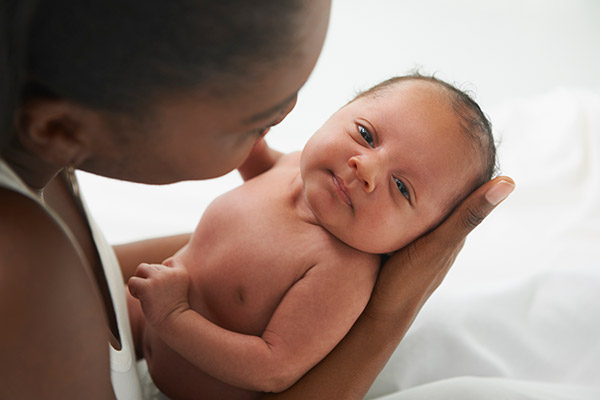 Mother holding her infant