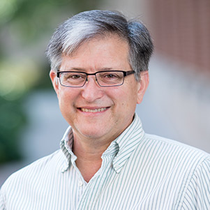 Jeff Bender wearing a dress shirt and smiling.