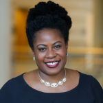 Rachel Hardeman in a black shirt and smiling.