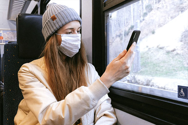 science-research woman with mask on train