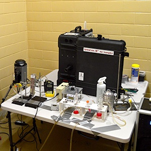 A variety of air samples on a table inside a testing space.