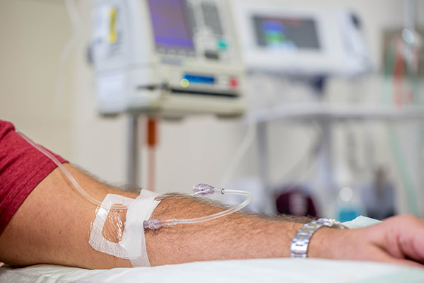 patient with I V in arm