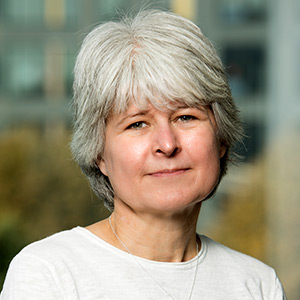 Lisa Harnack in a white shirt in front of a window.