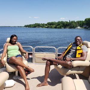 Joseph Akambase and wife on a boat