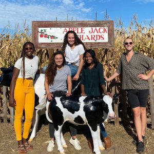 Angela Botiba with friends at apple orchard