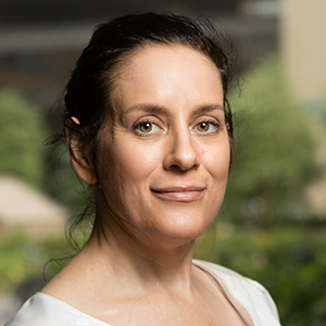 Helen Voelker in a white blouse.