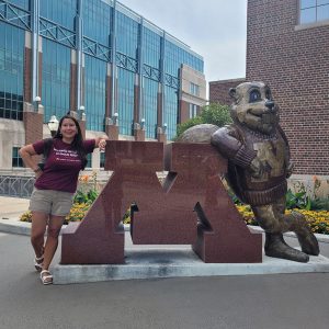 Stacy Hammer with Goldy Statue