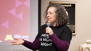 a woman presents with a microphone