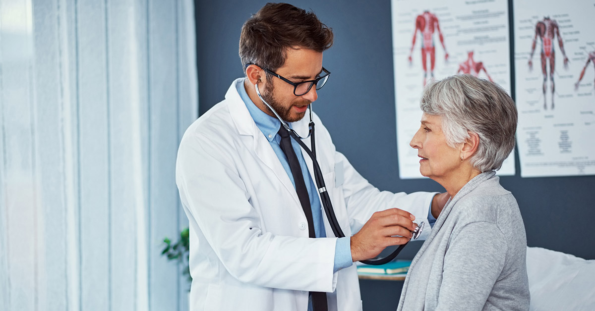 A doctor examining a senior patient at a clinic.