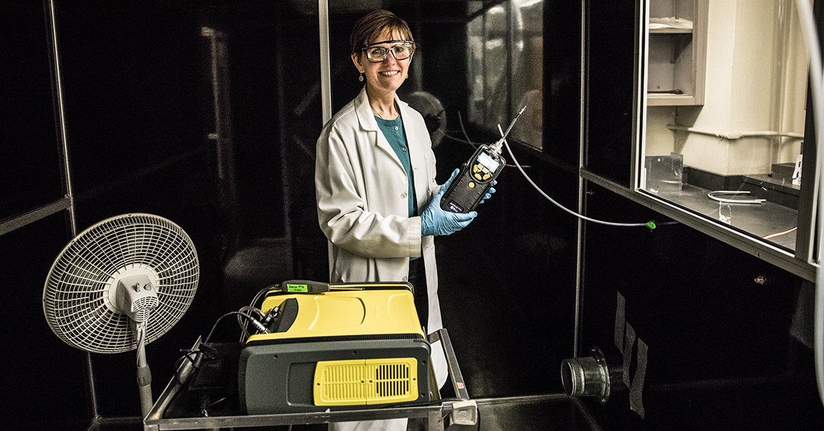 Susan Arnold taking a measurement inside her exposure chamber.