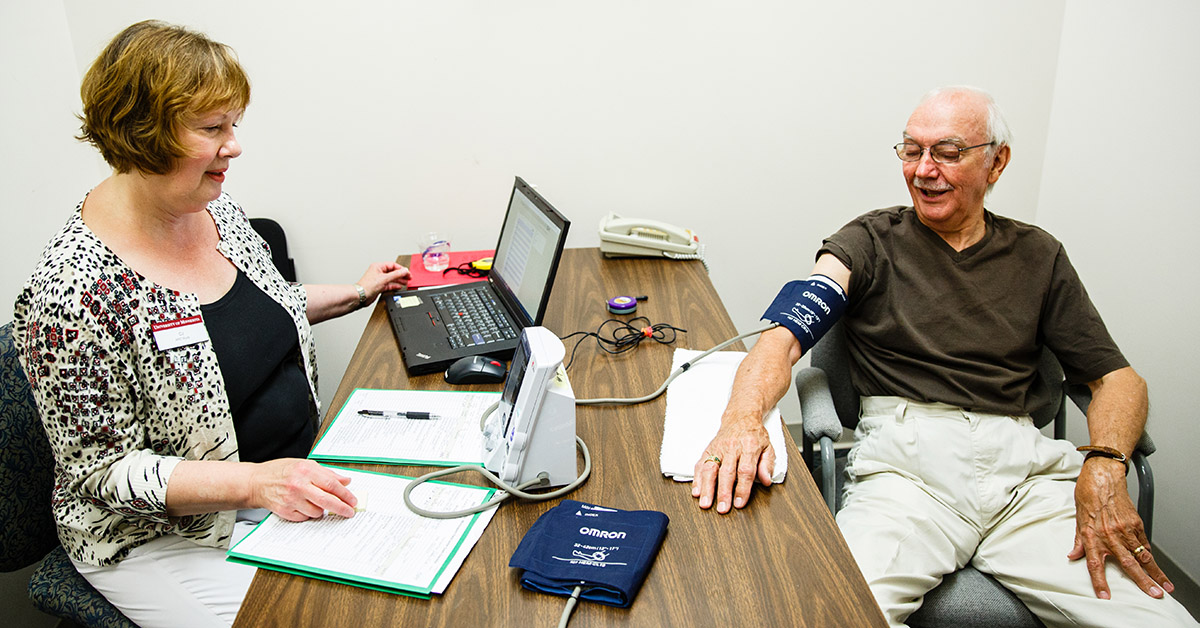 An ARIC participants gets his blood pressure checked.