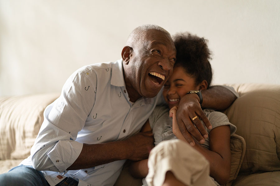 laughing grandparent and grandchild