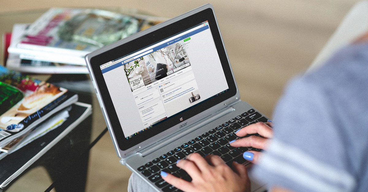 Woman using Facebook on a computer