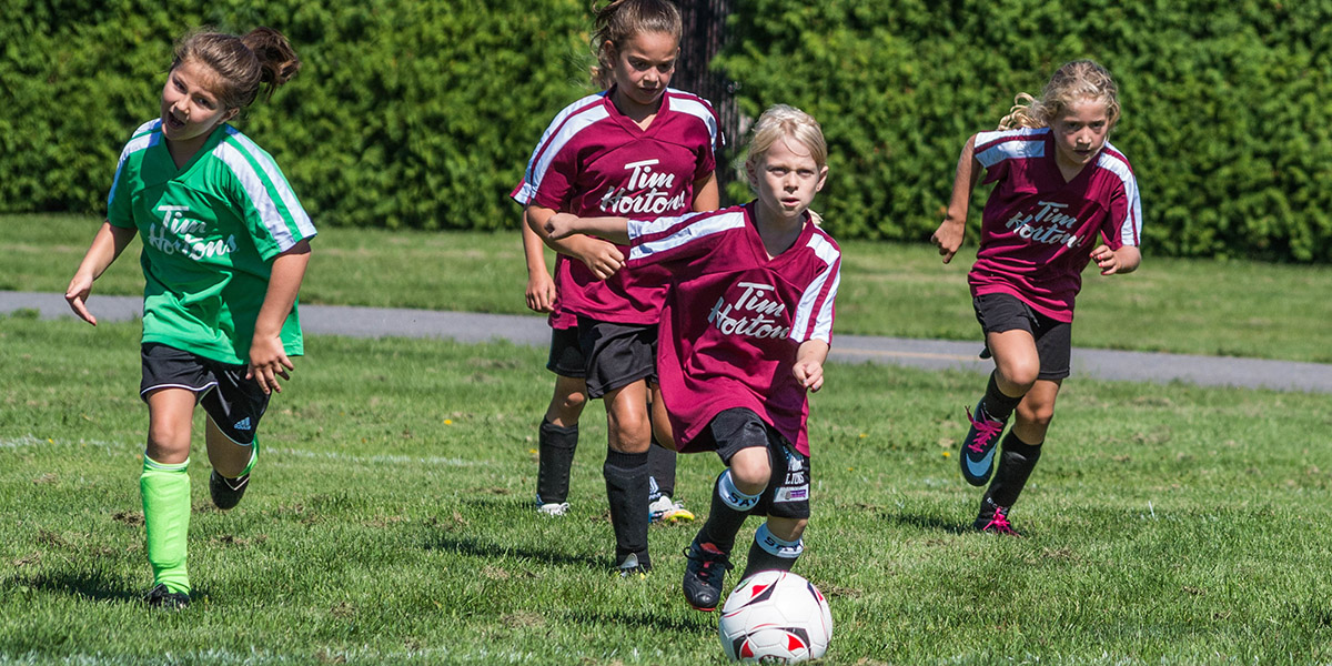 Children playing soccer.