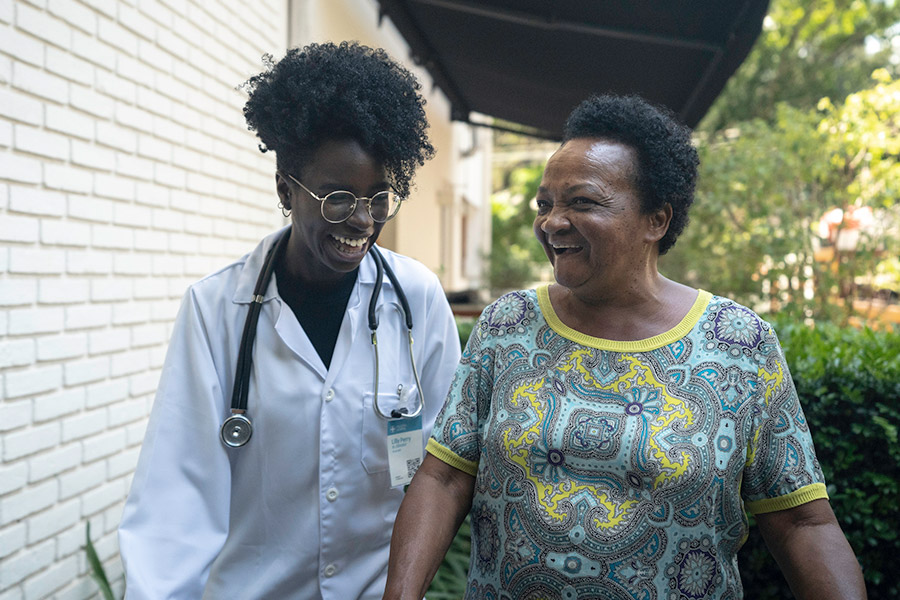 black doctor talking to another woman