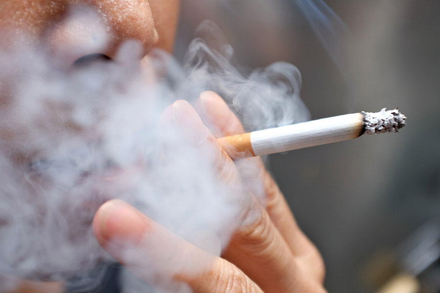 help-for-quitting someone smoking a cigarette