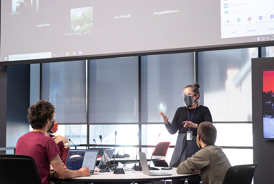 teacher-and-zoom teacher teaching hybrid class