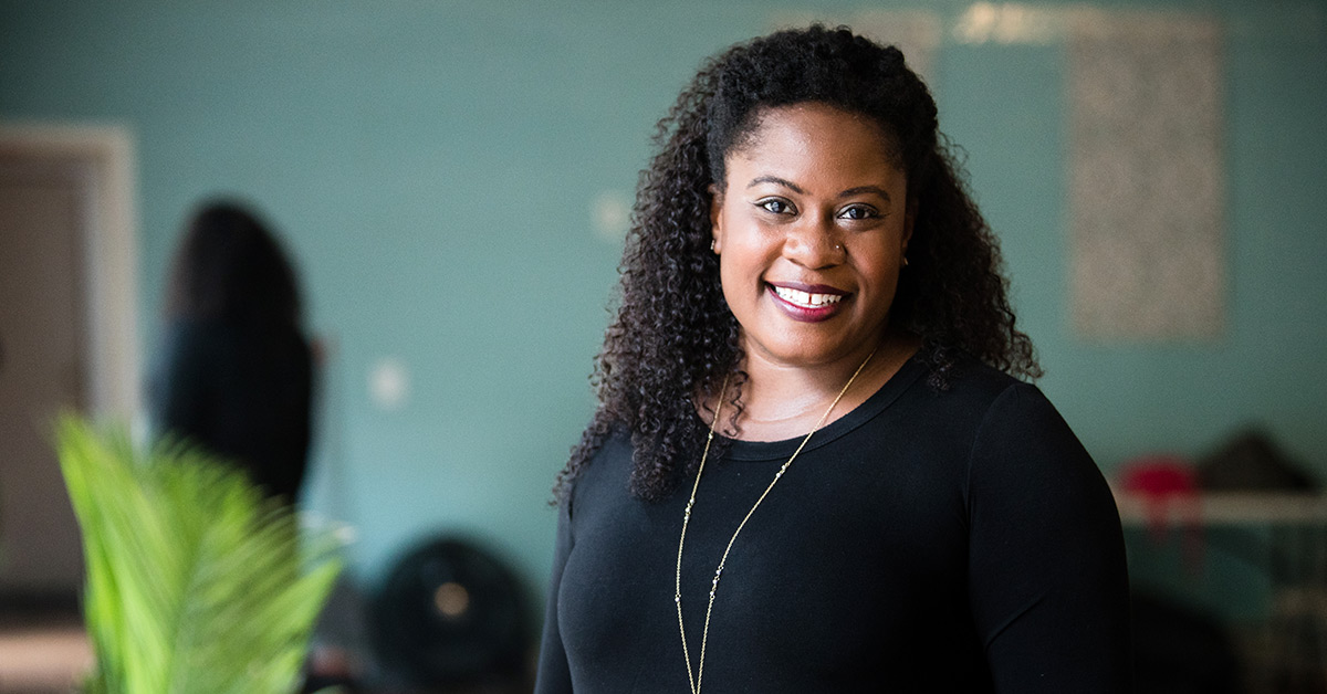 Rachel Hardeman wearing a black sweater and smiling.