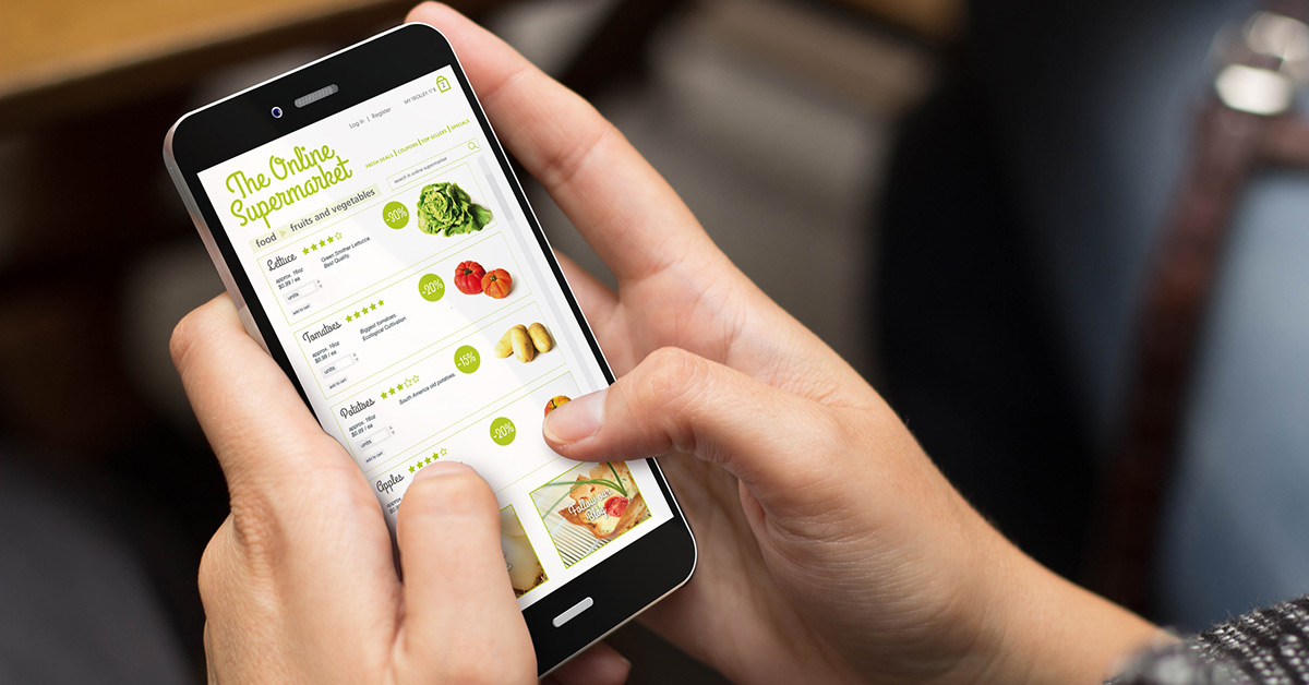 A customer uses a phone to shop for food online.