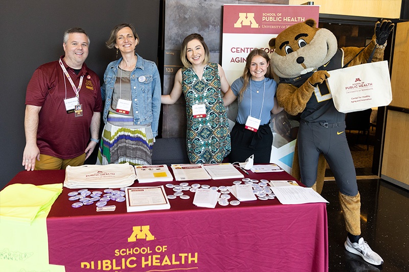 aging-02 Staff pose with Goldy the Gopher at the Center for Healthy Aging and Innovation's exhibit booth.