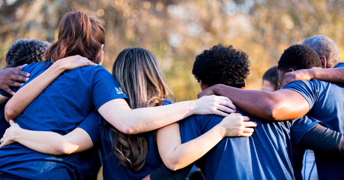 sports team holding each other