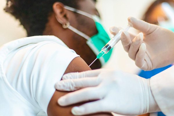 hp-small-feature-vaccine-disparity person getting a shot