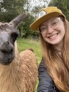 Amy Swenson takes a selfie with a llama.