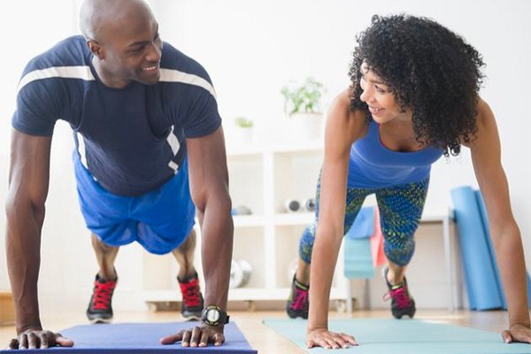 two humans exercising