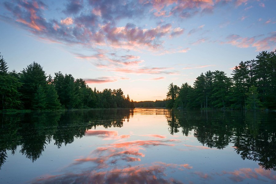 a peaceful lake with objectively pretty sunset