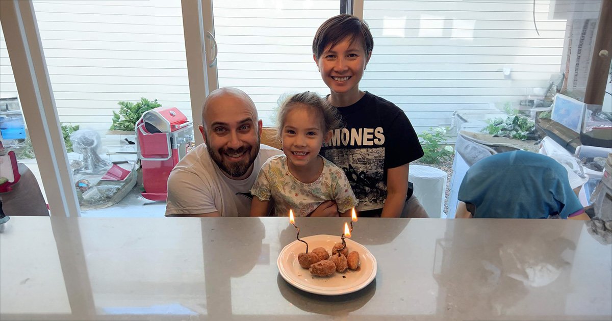 Tran and family smiling