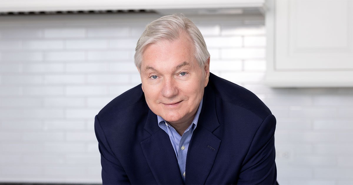 Michael Osterholm in blue shirt and dark blue jacket