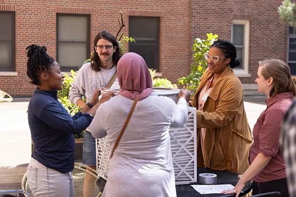 what-is-mph students discussing corsi rosenthal box