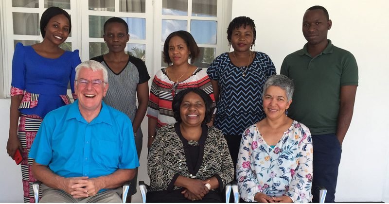 Group portrait of Simon Rosser and seven of his research colleagues in Tanzania