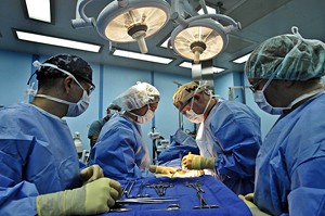 A surgery team operates on a patient.