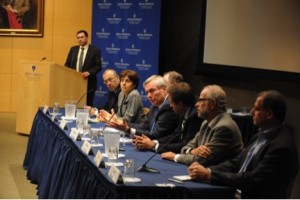 Michael Osterholm, table center in blue tie, spoke at Johns Hopkins University’s Dean Symposium on October 20, 2014, on the scope and challenges of the then-current Ebola epidemic. Photo credit: Larry Canner, courtesy of Johns Hopkins Bloomberg School of Public Health