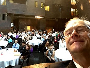 Dean Finnegan takes a selfie with nearly 300 new students at 2015 Orientation.