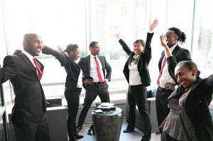 At the Emory Global Health Case Competition, the Minnesota team, including three public health students, stretches before presenting their case. 