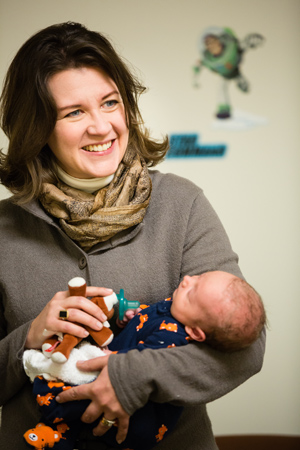 Ellen Demerath holding a baby