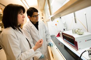 Associate Professor Irina Stepanov works with research associate Vipin Jain to determine chemicals found in cigarettes and smokeless tobacco.