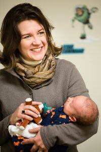 School of Public Health Professor Ellen Demerath with a one-month old MILK Study participant.