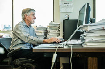 Jim Neaton working at his computer.
